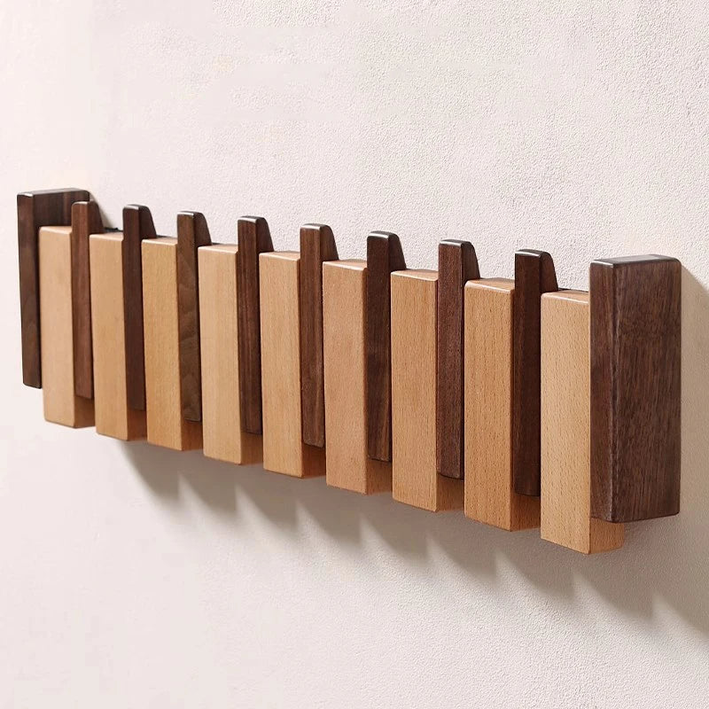 Houten wandkapstok met inklapbare haken