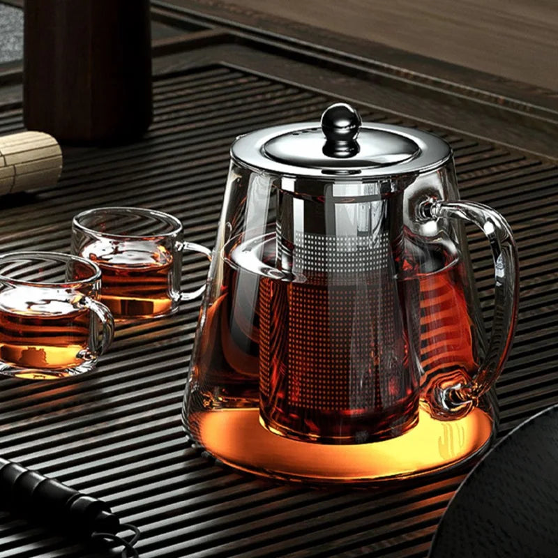 Glazen theepot met rvs theezeef en schenktuit