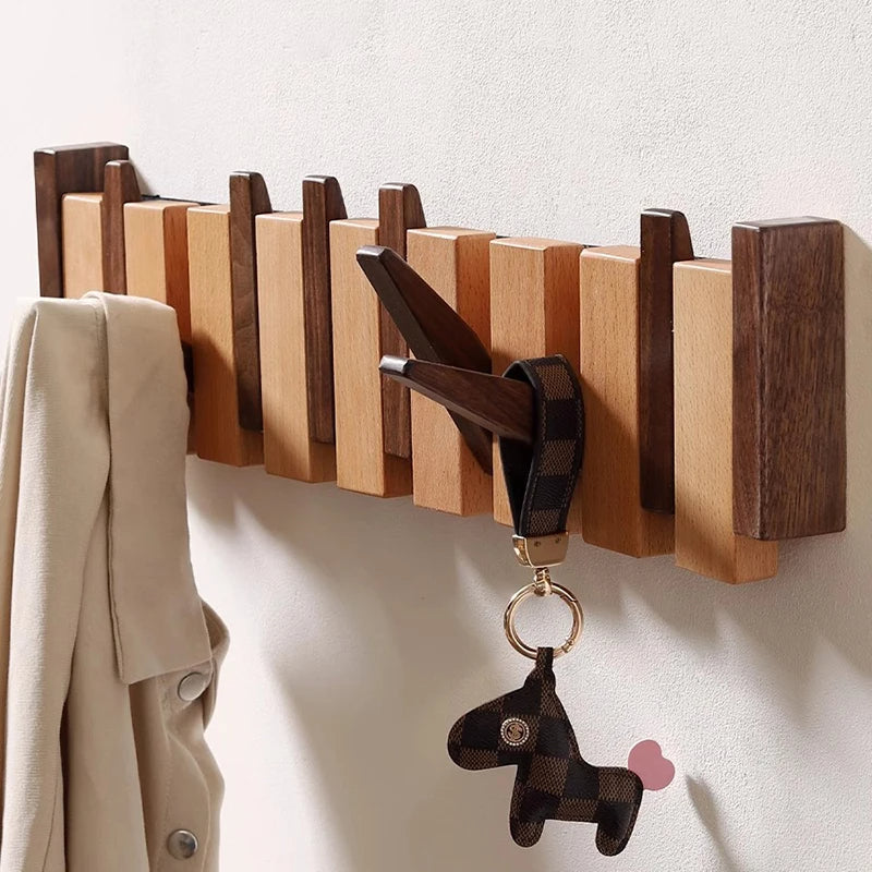 Houten wandkapstok met inklapbare haken