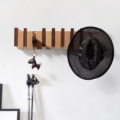 Houten wandkapstok met inklapbare haken
