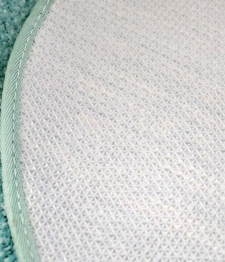 Ovaal vloerkleed met pompons en antislip