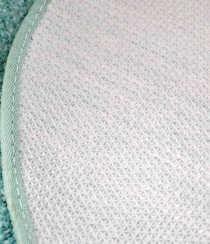 Ovaal vloerkleed met pompons en antislip