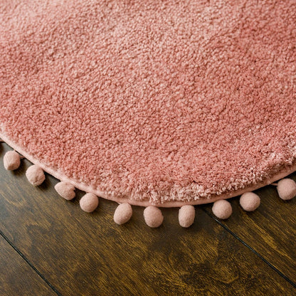 Ovaal vloerkleed met pompons en antislip