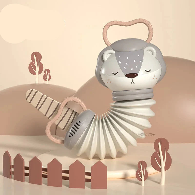 Babyaccordeon en rammelaar met zachte geluidseffecten