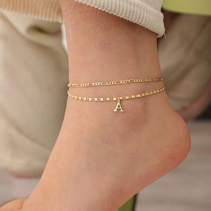 Gelaagde gouden enkelband met strass