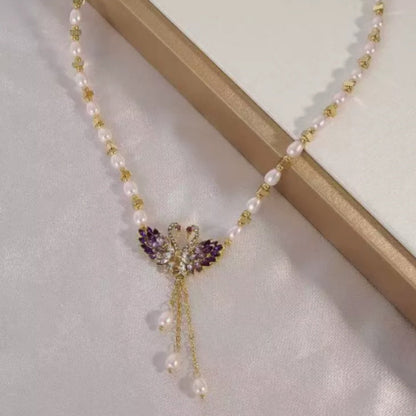 Paarse dubbele zwaan hanger ketting met fantasieparels