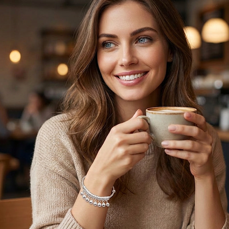 Verstelbare zilveren armband met belletjesbedeltjes