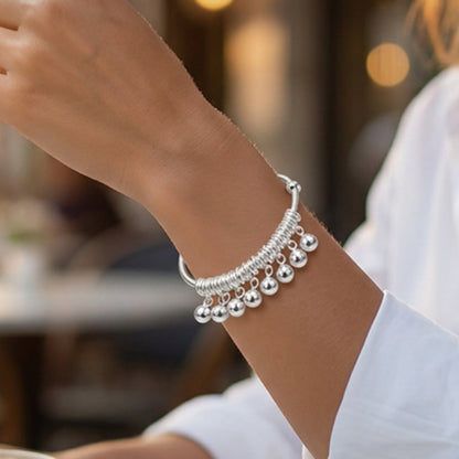 Verstelbare zilveren armband met belletjesbedeltjes