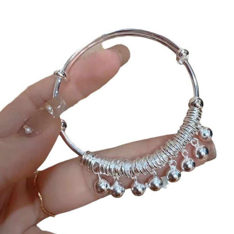 Verstelbare zilveren armband met belletjesbedeltjes