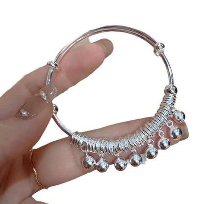 Verstelbare zilveren armband met belletjesbedeltjes