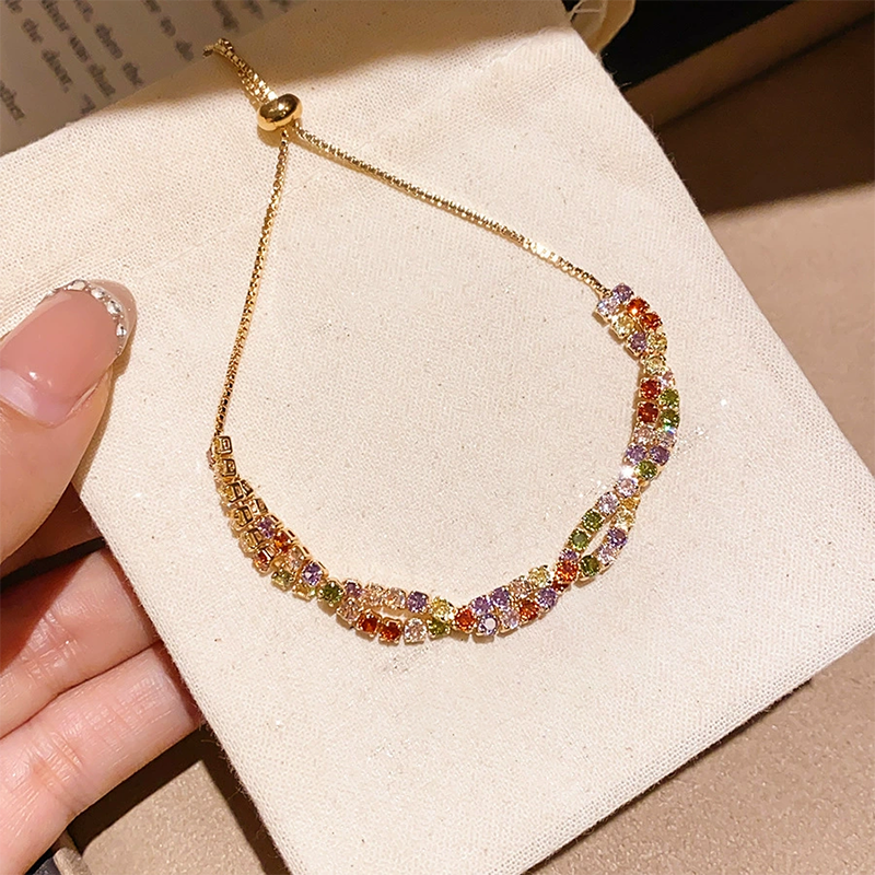 Verstelbare retro crossover armband met meerkleurige zirkonia